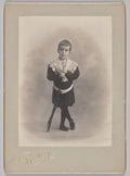 Untitled young boy with lace collar and toy rifle by Reutlinger Studios (French, active 1850s-1937) - Classic Art canvas print